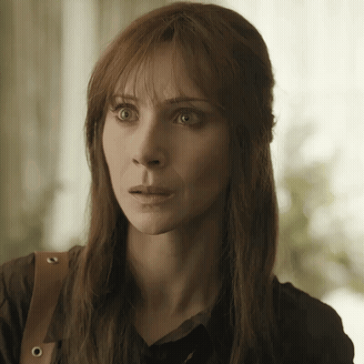 Woman Face Close Up With Purse GIF
