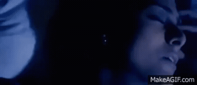 Woman Face In Dark With Eyes Closed GIF