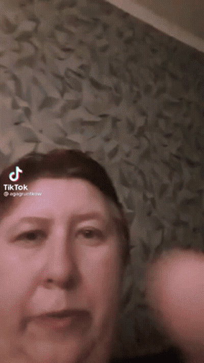 Woman Face In TikTok Video With Purple Background GIF