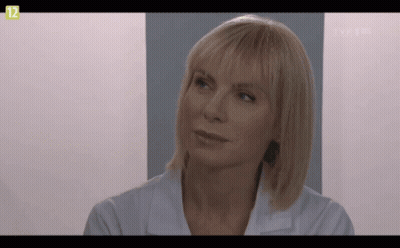 Woman Face On TV Screen With Number 12 GIF
