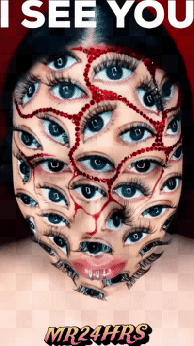 Woman Face Painted With Many Eyes Saying I See You GIF