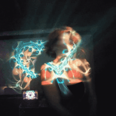 Woman Face Projected On Wall With Clock GIF