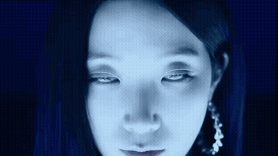 Woman Face With Blue Light Shining On Eyes GIF