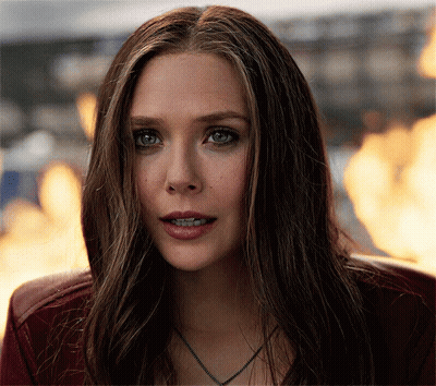 Woman Face With Fire Behind Her GIF
