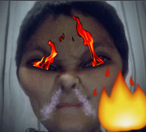 Woman Face With Flames And Fire Behind GIF