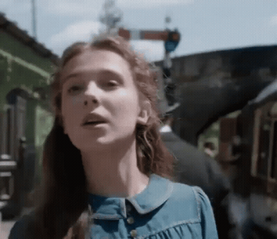 Woman Face With Train In Background GIF