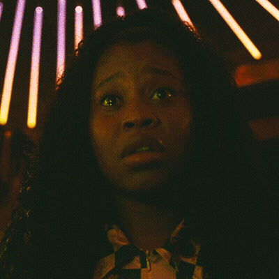 Woman Face With Yellow Light Behind Her GIF
