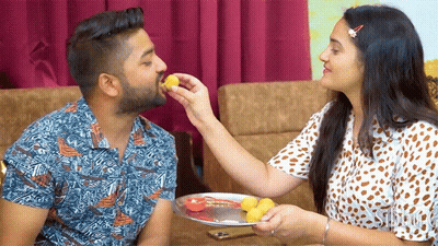 Woman Feeding Man Food From Plate GIF