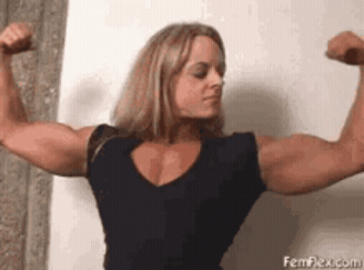 Woman Flexing Muscles In Black Shirt GIF