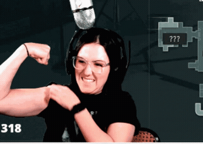 Woman Flexing Muscles In Front Of Microphone With Number 318 GIF