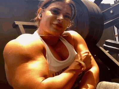 Woman Flexing Muscles In Lewis Tank Top GIF