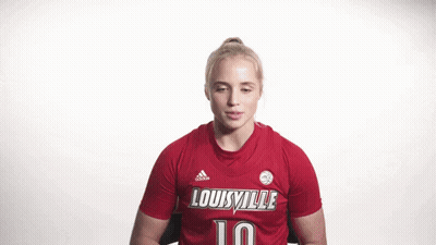 Woman Flexing Muscles In Red Louisville Jersey GIF