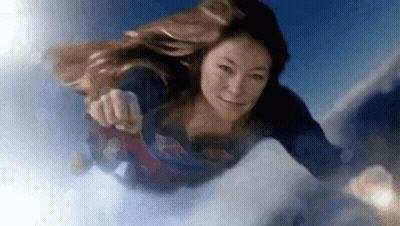 Woman Flying In Superman Costume GIF