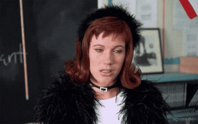 Woman Fur Coat Choker Blackboard Saying Cunt GIF