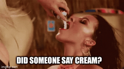 Woman Getting Cream From Woman's Mouth GIF