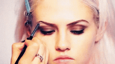 Woman Getting Eyebrows Painted By Makeup Artist GIF