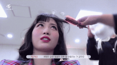 Woman Getting Hair Done with Red Brush