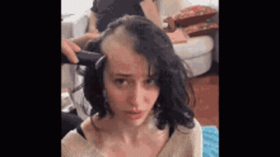 Woman Getting Hair Shaved By Man With Razor GIF
