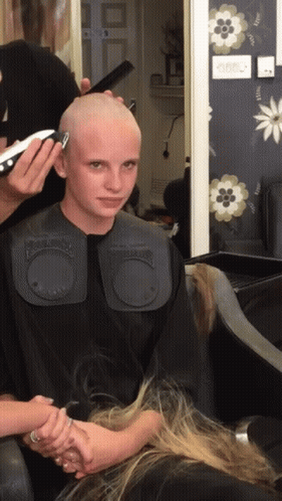 Woman Getting Haircut By Barber In Black Cape GIF