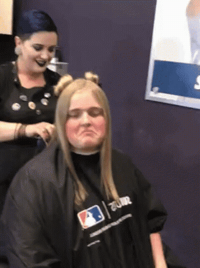 Woman Getting Haircut By Hairdresser In MLB Shirt GIF