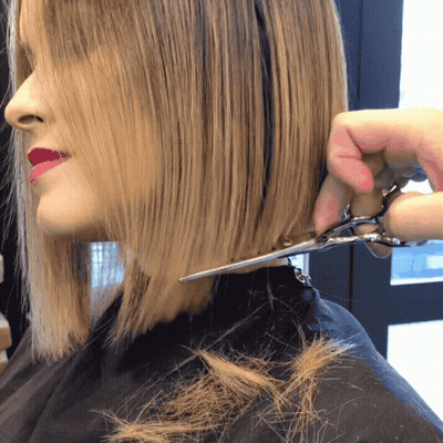 Woman Getting Haircut From Stylist GIF