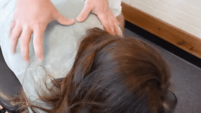 Woman Getting Massage From Doctor's Hands GIF