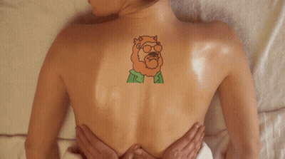 Woman Getting Massage With Back Tattoo GIF