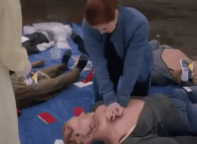 Woman Giving Heart Attack To Mannequin GIF