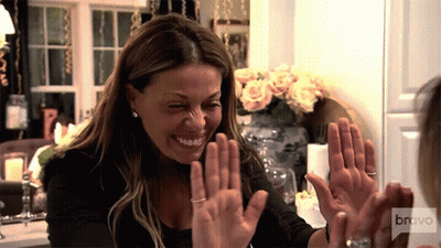 Woman Giving High Five With Bravo Logo GIF