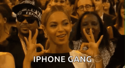 Woman Giving OK Sign With IPhone Gang Crowd GIF
