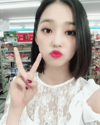 Woman Giving Peace Sign GIF