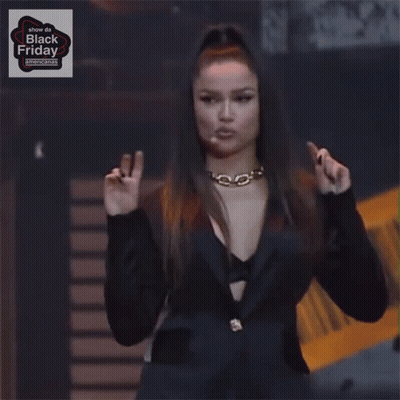 Woman Giving Peace Sign In Front Of Show Da Black Friday Sign GIF