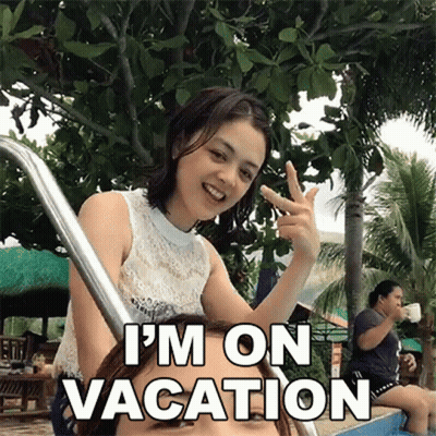 Woman Giving Peace Sign Next To Swimming Pool Saying I'm On Vacation GIF
