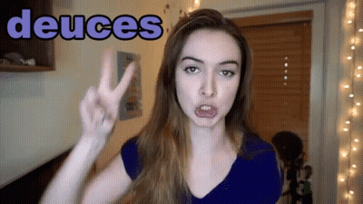 Woman Giving Peace Sign Saying Deuces GIF