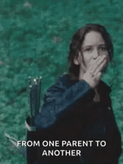 Woman Giving Peace Sign With Bow And Arrow GIF