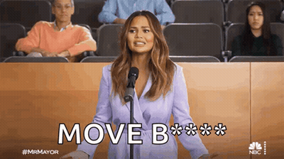 Woman Giving Speech At Microphone With Move On Screen GIF