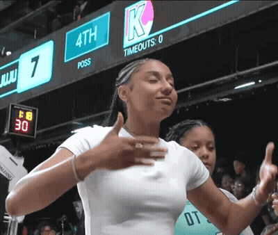 Woman Giving Thumbs Up In Front Of 4Th Scoreboard GIF
