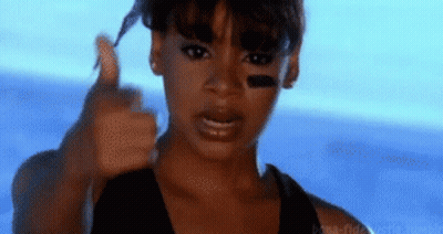 Woman Giving Thumbs Up In Front Of Blue Sky GIF