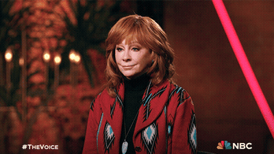 Woman Giving Thumbs Up In Front Of NBC Sign GIF