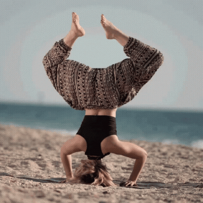 Woman Handstand Head In Sand On Beach GIF