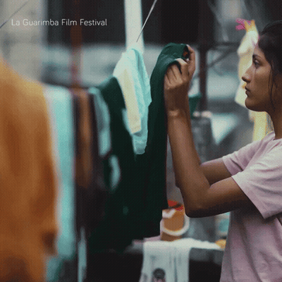 Woman Hanging Clothes With La Guarimba Film Festival GIF