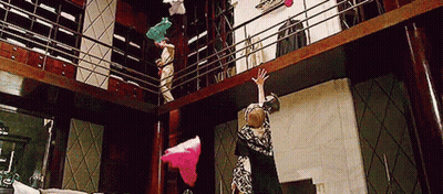 Woman Hanging Upside Down From Balcony GIF
