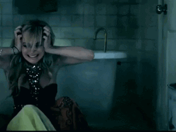 Woman Having Headache In The Bathroom GIF