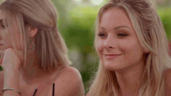 Woman Head Down With Smile On Her Face GIF