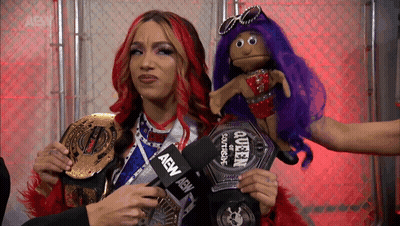 Woman Holding AEW Microphone GIF