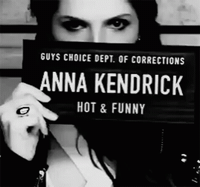 Woman Holding Anna Kendrick Hot And Funny Sign GIF