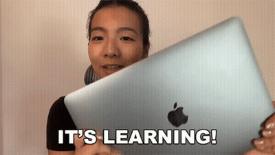 Woman Holding Apple Laptop Saying It's Learning GIF