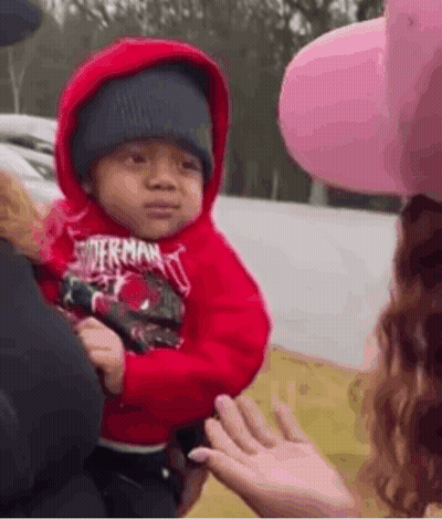 Woman Holding Baby In Red Hoodie And Hat GIF