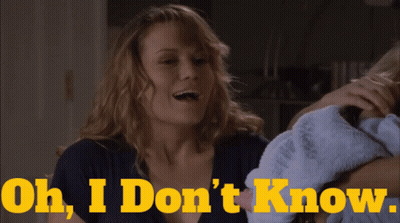 Woman Holding Baby Saying Oh I Don't Know GIF