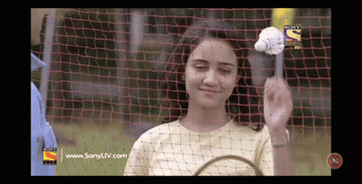 Woman Holding Badminton Racket In Front Of Sony TV GIF